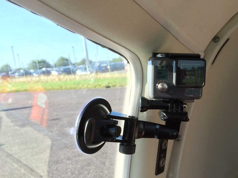 GoPro HERO camera attached to the inside of an aeroplane using a DEYARD Suction Cup Mount on the window